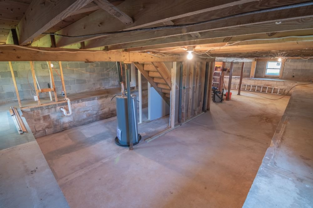 Empty basement being assessed before a finishing project