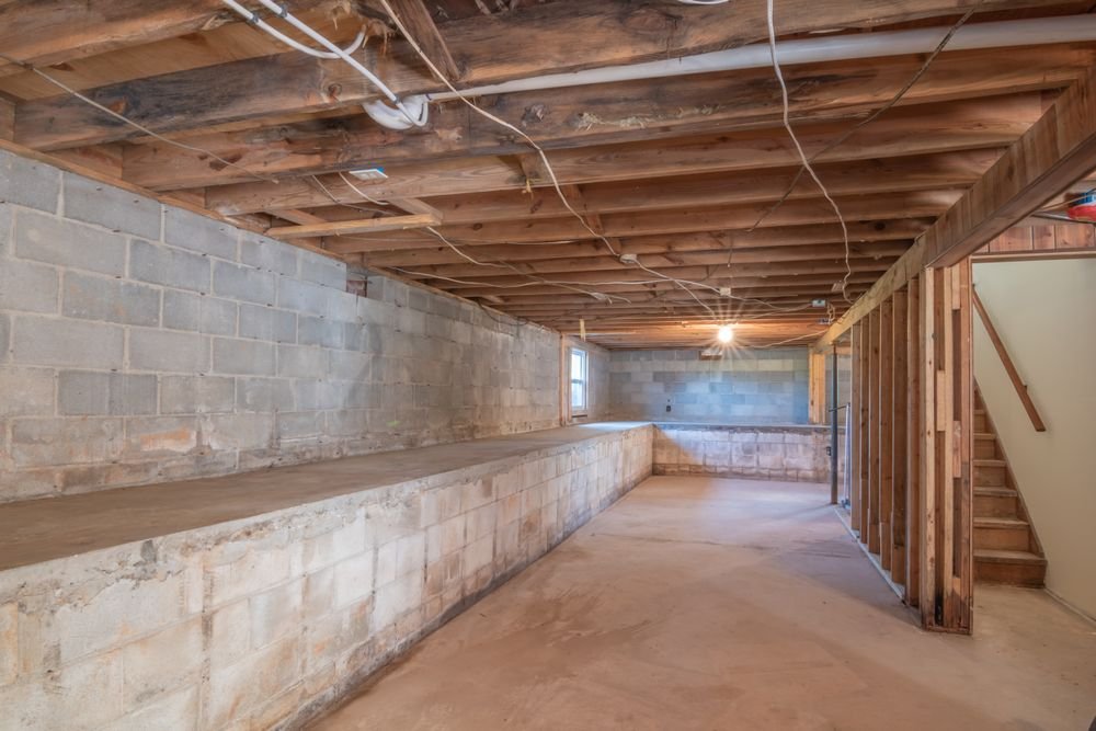 Empty basement space before addressing moisture control