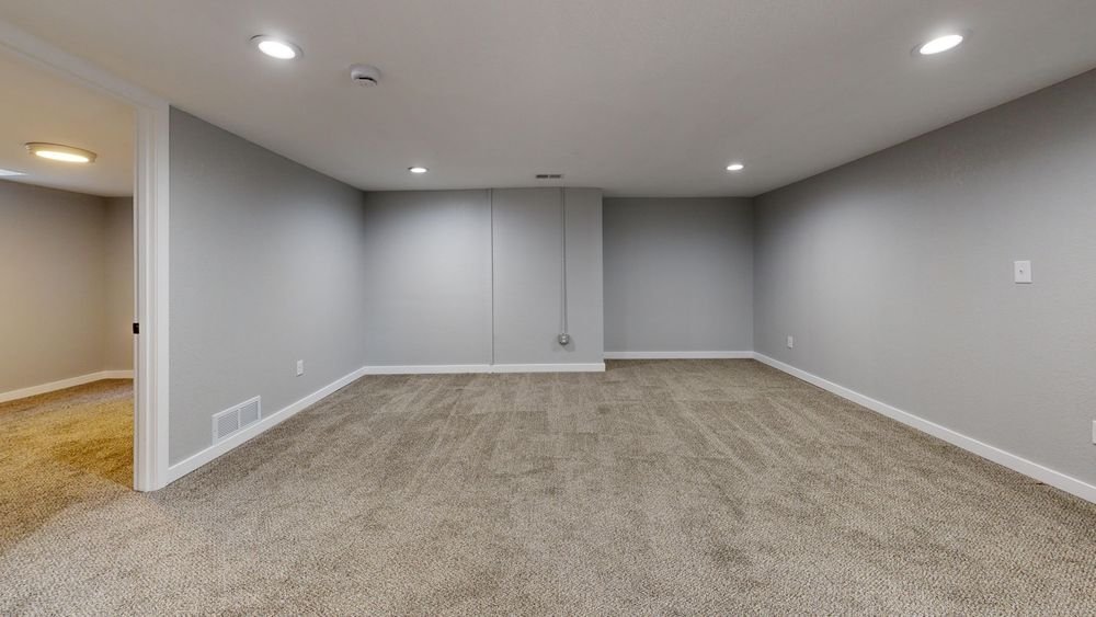 Spacious empty basement room ready to be turned into useful living space