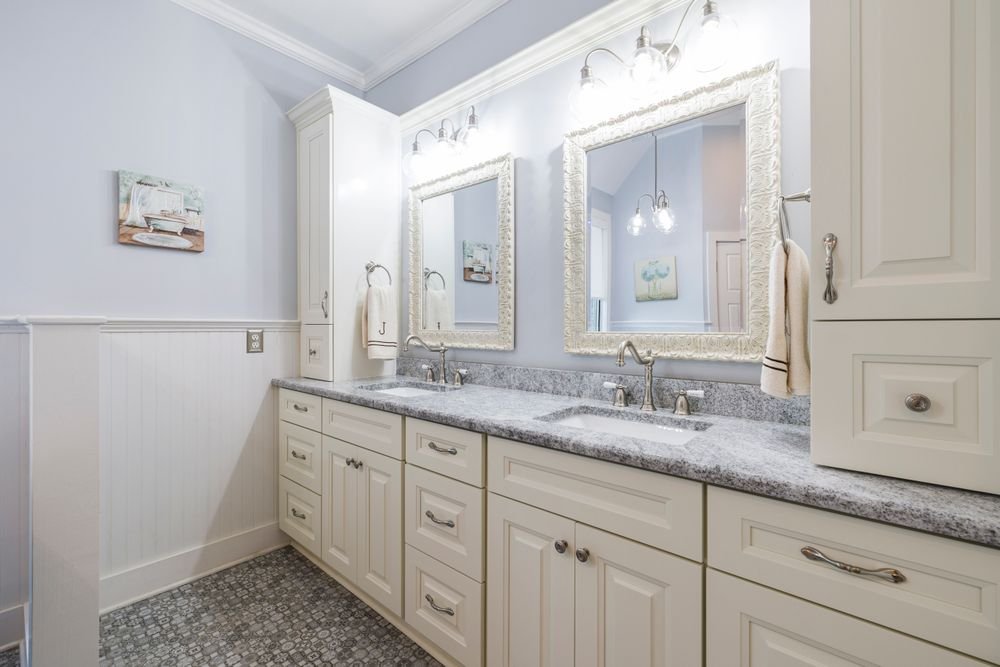 Bathroom vanity with granite counter and cabinet storage