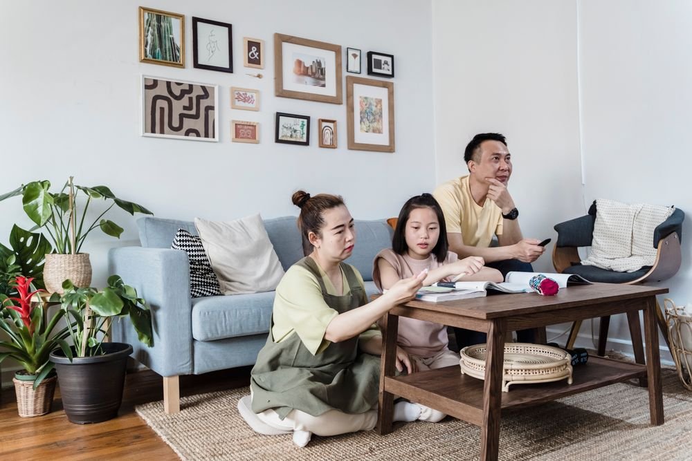 Family relaxing together in a renovated living room