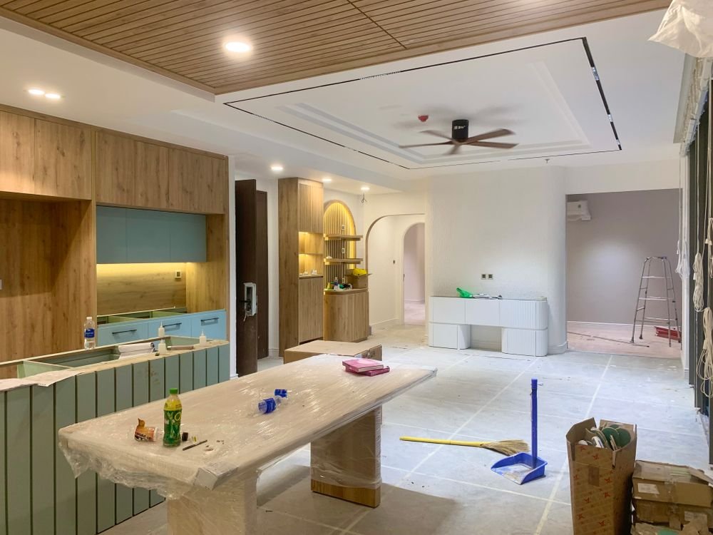 Kitchen and dining area mid-renovation showing budget-driven upgrades